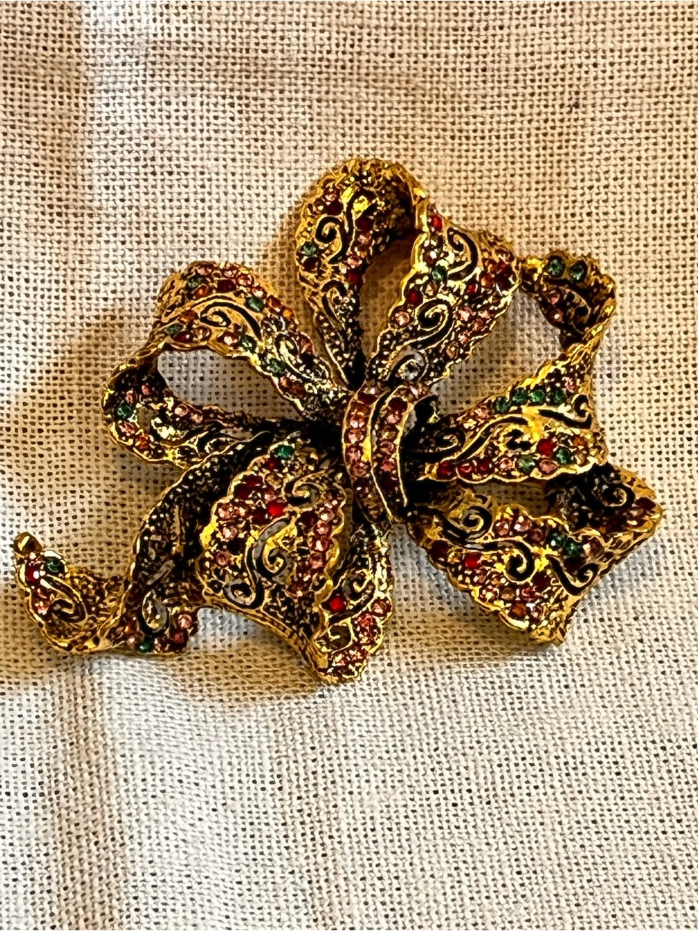 Gold-Tone Ribbon Bow Brooch with Red and Green Accents